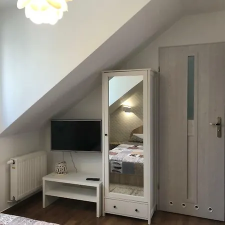 Pokoje Goscinne E&m ホームステイ Mikołajki